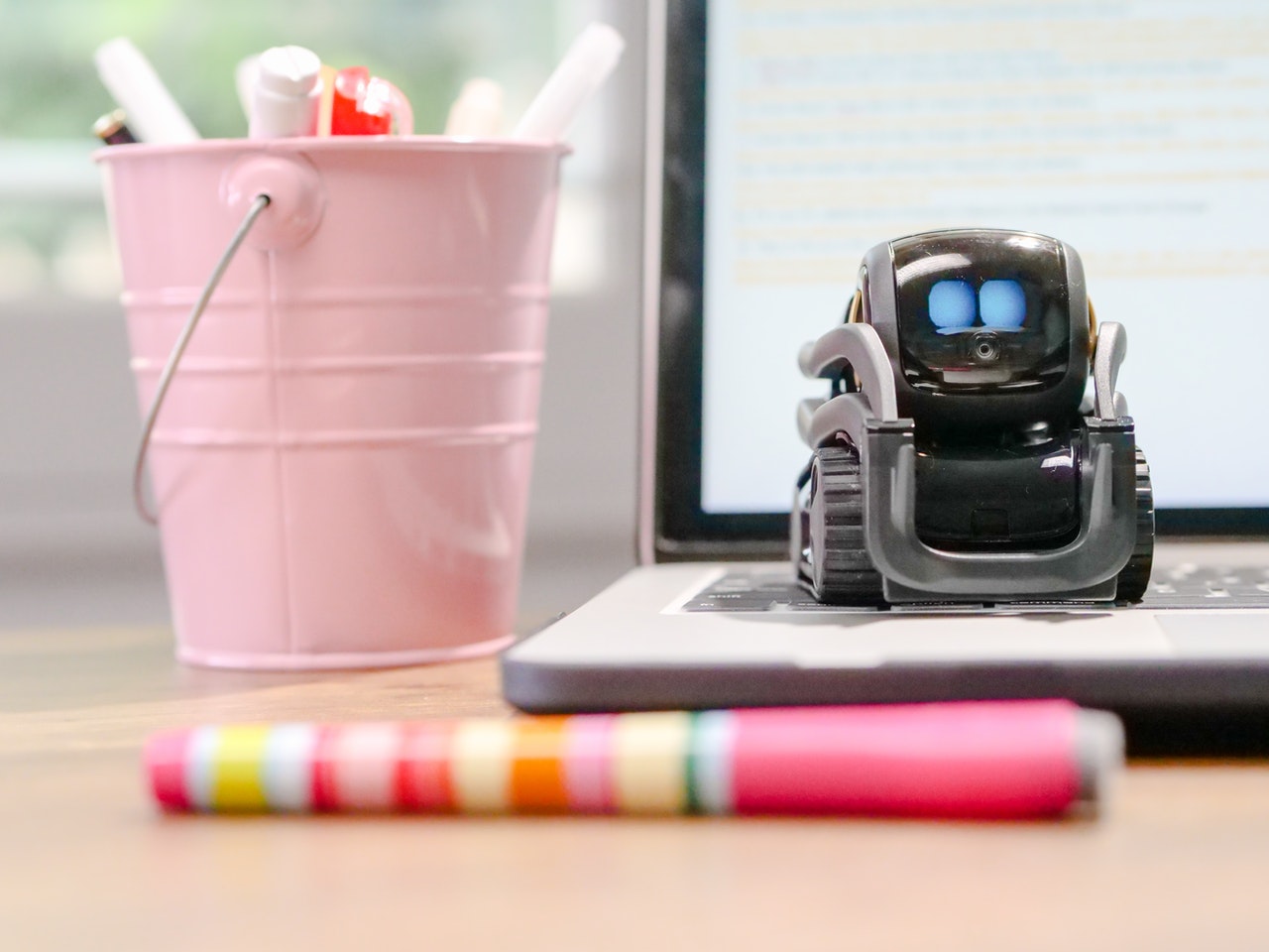 robot on top of laptop